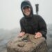 Princess Kate in a baseball cap hiking up a mountian