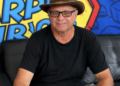 Kevin Lyman sits in front of a bright background.
