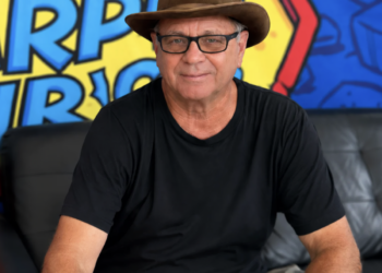 Kevin Lyman sits in front of a bright background.