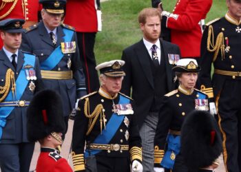 FILE - Britain's King Charles III, Princess Anne, Prince William and Prince Harry follow Queen Elizabeth II's coffin at Windsor Castle, Windsor, England in 2022.