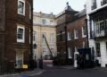 Police officers stand guard outside a rear entrance to Clarence House, an official residence of Britain’s King Charles, in London, on Tuesday. Photo: Reuters