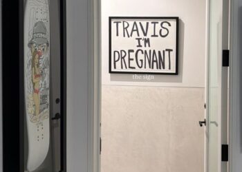 Kourtney Kardashian's 'Travis I'm Pregnant' sign on a wall at her homeCredit: Kourtney Kardashian/Instagram