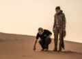 (L-r) Director/Writer/Producer DENIS VILLENEUVE and Zendaya on the set of Warner Bros. Pictures and Legendary Picturesâ€™ action adventure â€œDUNE: PART THREE,â€ in the Liwa Desert, Abu Dhabi. A Warner Bros. Pictures release. Photo by Niko Tavernise.