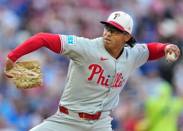 Philadelphia Phillies starting pitcher Jesus Luzardo throws during the first inning of a baseball game against the Kansas City Royals, Saturday, July 4, 2026, in Kansas City, Mo. (AP Photo/Charlie Riedel) - The Associated Press