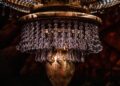 A section of the 2,000-pound chandelier set piece for "Phantom of the Opera" hangs in the Hollywood Pantages Theatre.