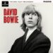 Image may contain: David Bowie, Face, Head, Person, Photography, Portrait, Publication, Adult, Clothing, and Coat