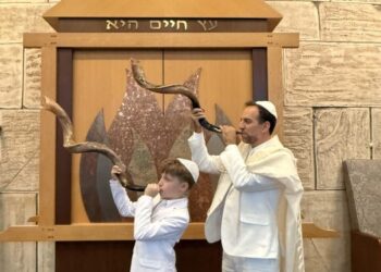 Rabbi Brian Shamash performs with his son, Ethan. The new rabbi and hazzan of Lake Success Jewish Center believes music can bring people together, deepen faith and make Jewish learning more accessible.