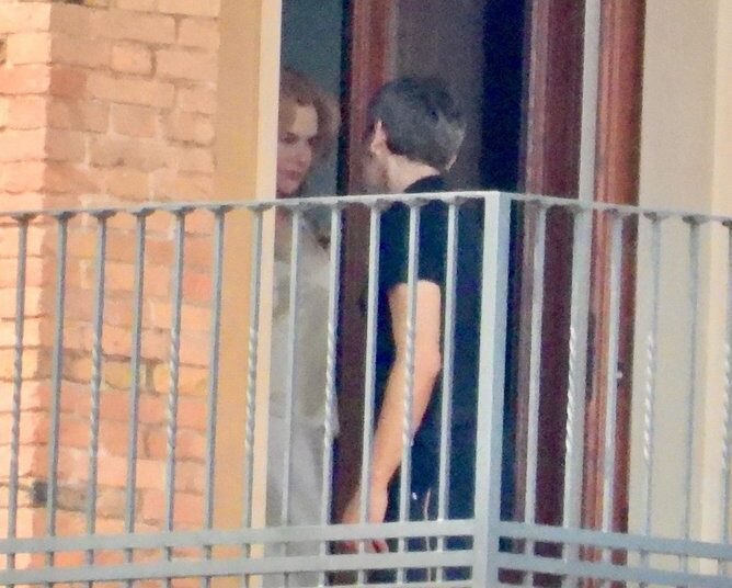 Nicole Kidman shares a farewell with a mystery man outside the suite of her Italian hotel.
