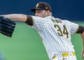 Michael King throws a pitch at Petco Park.