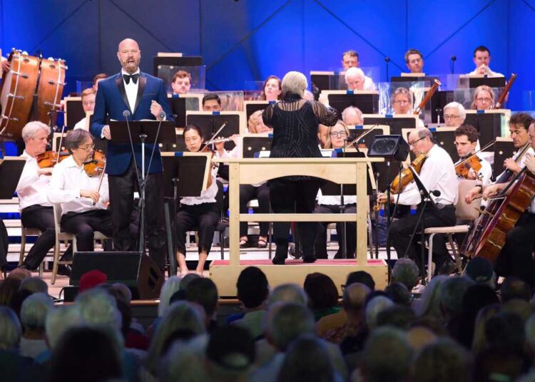 Baritone Zachary James and the Boston Symphony Orchestra, led by conductor Karen Kamensek, perform Philip Glass' Symphony No. 15 'Lincoln' at Tanglewood in Lenox, Mass. on July 5, 2026.