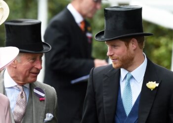 Prince Harry talks to King Charles III at the Royal Ascot horse racing meeting in Ascot, England, on June 14, 2016, when Charles was still Prince of Wales.