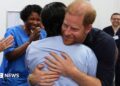 Prince Harry hugs a nurse on his visit to Birmingham Children's Hospital
