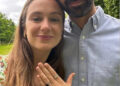man and woman with engagement ring