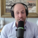 Prince William sitting in front of a mic and a painting