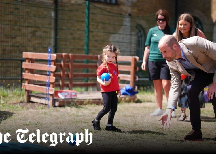 Prince of Wales plays bowls with schoolchildren
