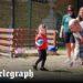 Prince of Wales plays bowls with schoolchildren