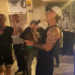 Robbie Williams surprises fans as he’s spotted busking in the streets of Spain