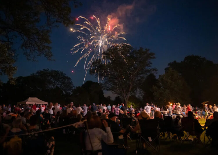 Fireworks explode during the annual Salute to America event at Greenfield Village, in Dearborn, July 3, 2023.