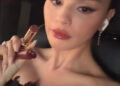 Selena Gomez showing off her look for Taylor Swift's rehearsal dinner.