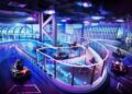 Indoor go-kart track with neon lights and multiple racers on a curved track.