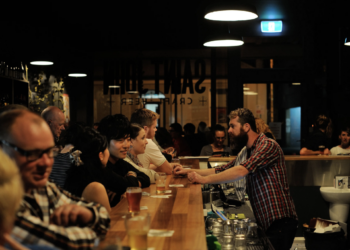 people at the bar in a pub