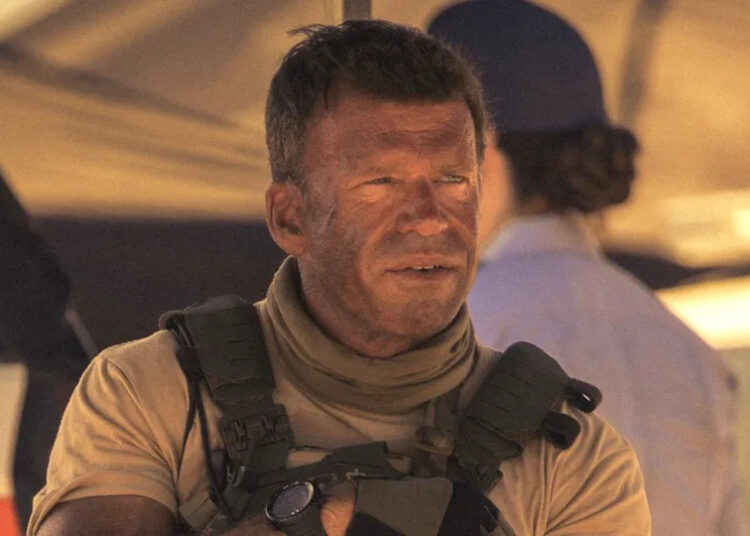 Taylor Sheridan's dirt-faced Cody sitting with Joe in Lioness Season 1.