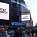 A message on the video screens outside Madison Square Garden announces that Taylor Swift and Travis Kelce are married.