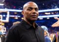 Charles Barkley standing courtside at an NBA Cup game in Phoenix