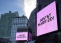 Screens display Just Married after Taylor Swift and Travis Kelce wedding.