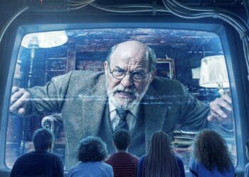 Sigmund Freud peers out of a screen at the