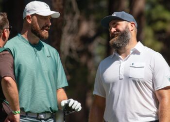Travis Kelce and brother Jason Kelce talk on the 4th tee during the first round of the American Century Celebrity Championship golf tournament at Edgewood Tahoe Golf Course in Stateline, Nev., Friday, July 12, 2024. (Photo: Tom R. Smedes/ Reno Gazette Journal)