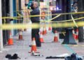 Forensics photographer takes photo of crime scene