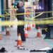 Forensics photographer takes photo of crime scene