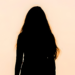 Silhouette of a woman against an early morning sky contemplating her weekly horoscope for July 19-25, 2026