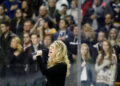 Jillian Cardarelli, of Haverhill, Mass., sings the national anthem before the start of an NHL hockey game between the Boston Bruins and Columbus Blue Jackets in Boston, Saturday, Nov. 30, 2013. (AP Photo/Mary Schwalm)