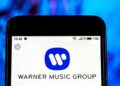 Música universal, a Warner Music estoca as licenças do New Spotify