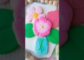 Pink cookie mason jar bouquet with 3 flowers and 2 leaves #cookiedecorating #royalicing