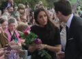 Resurfaced Meghan Markle footage shows Duchess of Sussex breaking royal protocol during the awkward walkabout with William and Kate after the Queen’s death – as lip reader reveals what she REALLY said