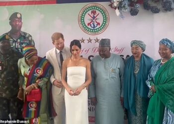Resurfaced video shows Meghan Markle subtly ignoring Prince Harry and his nudges as they pose for a photograph during their faux royal tour in Nigeria