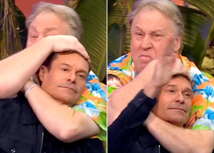Ryan Seacrest bate depois que o ex-linear o coloca em um headlock em "Wheel of Fortune"