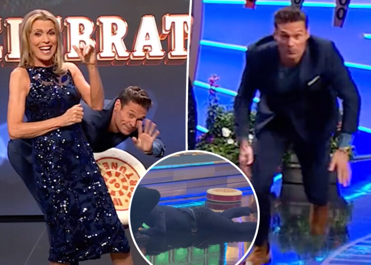 Ryan Seacrest cai na fase 'Wheel of Fortune' durante as filmagens