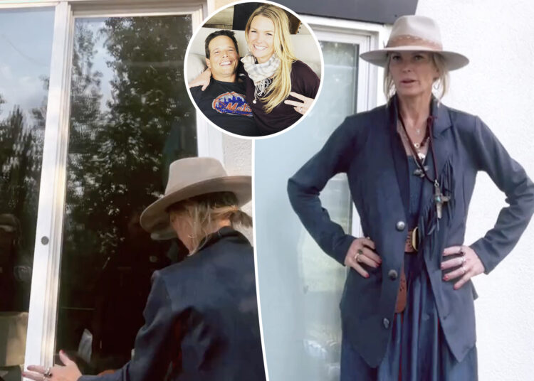 Kelley Wolf luta para entrar em casa da família durante a transmissão ao vivo após a ordem de restrição de gotas de Scott Wolf