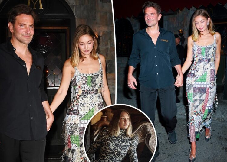 Gigi Hadid segura as mãos com Bradley Cooper enquanto eles celebram sua capa da Vogue em Nova York