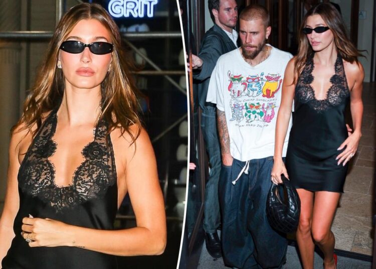 Hailey Bieber atordoa em Little Black Dress enquanto ela acozava Justin na festa de lançamento de 'Swag II'