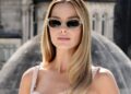 Margot Robbie atordoa em sutiã rosa nu e saia de fenda em Londres