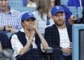 Prince Harry and Meghan Markle’s style statement: Couple deliver subtle message of unity as they ‘mirror’ each other at A-list baseball game – as Royal Family’s battles continue