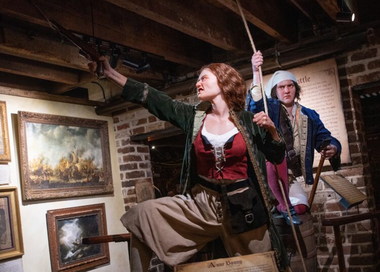 An exhibit in the Savannah Pirates and Treasure Museum depicts Anne Bonny (center) and Mary Read, who were among the few female pirates during the Golden Age of Piracy. (Courtesy of Travis Spagenhurg)