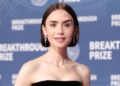 Lily Collins posando em mini-shorts merece uma segunda olhada