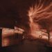 Um enorme tornado gira na tela panorâmica durante a sequência do tornado em Sphere's...