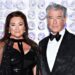 A esposa de Pierce Brosnan quer que ele diminua o ritmo devido a problemas de saúde